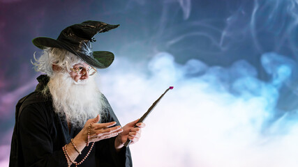 Wizard old man casting spell with magic wand