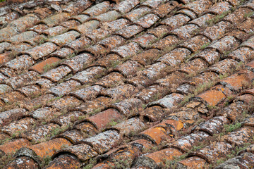 Aged terracotta roof tiles with textured surface