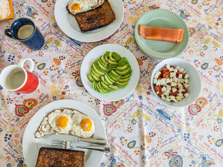 Delicious homemade brunch with eggs, avocado, and smoked salmon
