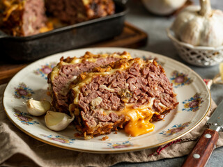 Meatloaf: Homestyle meatloaf glazed with ketchup and brown sugar. Moist blend of beef and pork, sliced thick&mdash;comforting centerpiece for Sunday dinners or diner menus.