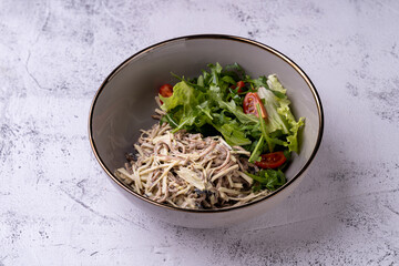 A delicious bowl showcases a mix of succulent shredded chicken paired with crisp greens and cherry tomatoes, drizzled in a rich creamy dressing. Perfect for a light lunch or dinner
