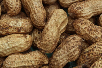 Raw peanuts in shell with natural texture and copy space perfect for food or rustic background