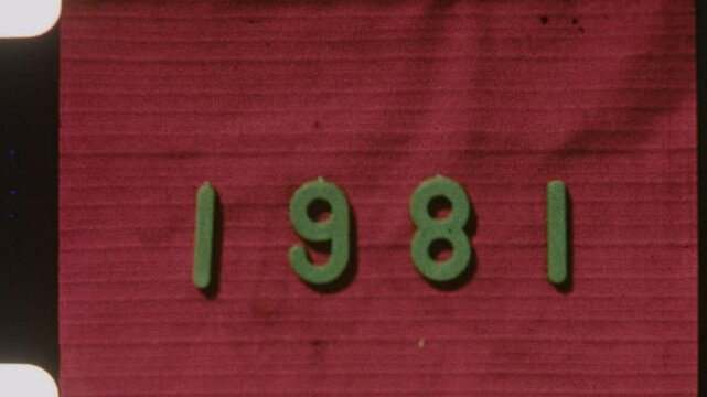 8mm Film Strip Displaying 1981 Date With Red Textured Backdrop