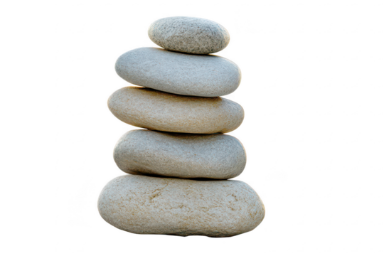 Vertical arrangement of natural smooth grey stones in a balanced zen stack isolated on a transparent background