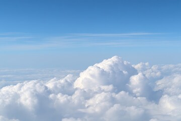 Aerial View of Fluffy White Cumulus Clouds Against a Clear Blue Sky