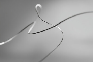 Obraz premium serene composition of thin lines forming abstract design that creates illusion of depth on ultrabright light