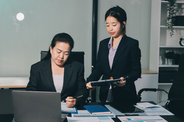 Teamwork with business people analysis cost graph on desk at meeting room. double exposure successful teamwork,business planning concept.
