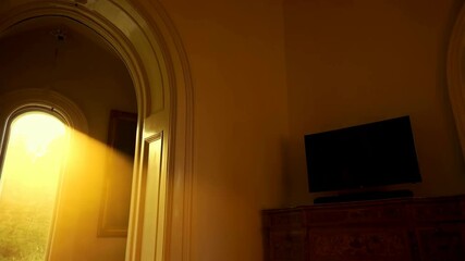 Sunlit interior hallway view with hardwood floors and open doorway, antique furniture and carpet, golden hour glow - Powered by Adobe