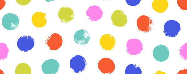 Colorful seamless polka dot pattern. Brush drawn rough multi colored circles. Funky abstract simple background with dots.