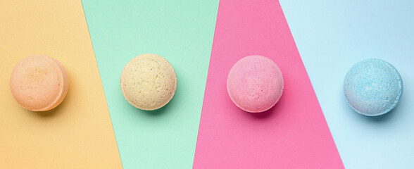 Bath bombs on color background