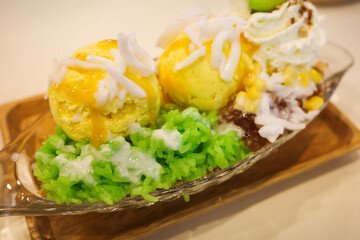 mango ice-cream with sticky rice, coconut milk and whipped cream