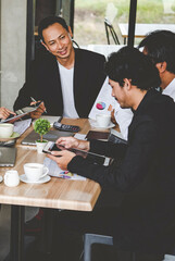 Vertical Horizon Close up hands group of Business People meeting in conference room pointing financial document. Vertical business team brainstorming partner teamwork. Close up hand team meeting