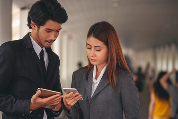 Group of Asian business people diversity talking meeting outside office. Multiethnic teamwork collaboration team meeting. Business people shaking hands together diversity multiethnic Business partner