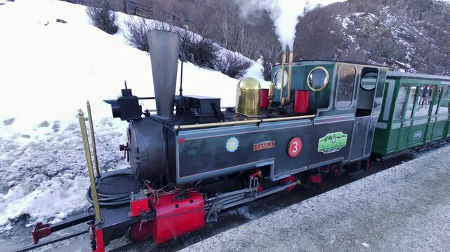 Train Station In Ushuaia Tierra Del Fuego Argentina. Urban Scene Of Railway Train Station In Downtown District. Nature Travel Snow Covered Forest Trees. Nature Outdoors High Angle View.