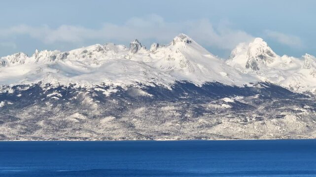 Mountain Time Lapse In Cape Horn Puerto Navarino Chile. Breathtaking Aerial View Of Time Lapse Drone Footage. Snow Fall Lake Glacial Lake Snow Capped. Forest Trees Glacial Lake Nature.