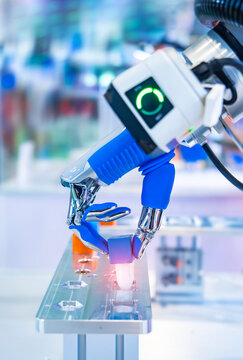 Artificial robotic hand at the presentation of robotics.Creation of artificial intelligence