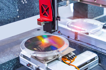 Silicon Wafers and Microcircuits integrated circuits to manufacture CPU and GPU with Automation system control application on automatic robot arm