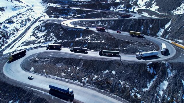 Los Caracoles Highway Road In Andes Mountains Santiago Chile. Breathtaking Aerial View Of Busy Traffic In A Freeway Road. Snow Fall Countryside Glacial Landscape Blizzard.
