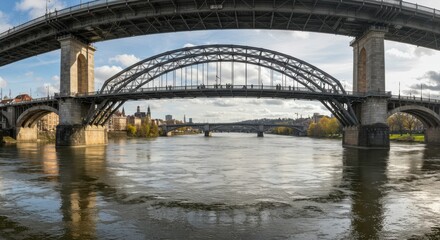 Naklejka premium Architectural Bridges Over a River: A stunning panoramic view of impressive bridges gracefully spanning a wide river. The image celebrates the beauty of architectural prowess. The structures.