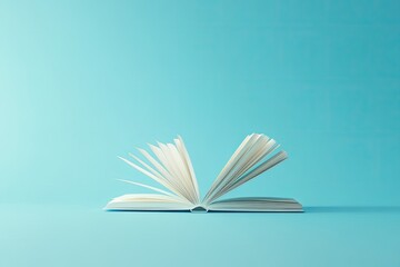 Open book with white pages against light blue background, simple composition