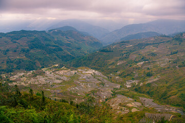 Obraz premium Beautiful sunset over Yuanyang Rice terraces in Laohuzui area, Yunnan, China. UNESCO World heritage site