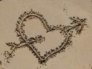 Romantic Heart and Arrows Drawn in Sand