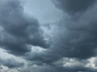 Dramatic Storm sky with dark blue and grey cumulus. Rainy clouds background texture. Just before the heavy rain or thunderstorm. dramatic dark clouds in the sky. Beautiful landscape with cloudy sky.