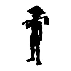 Silhouette of a farmer working in the field with a hoe