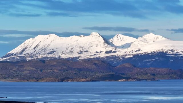 Mountains Time Lapse In Cape Horn Puerto Navarino Chile. Breathtaking Aerial View Of Time Lapse Drone Footage. Snow Fall Lake Glacial Lake Snow Capped. Forest Trees Glacial Lake Nature.