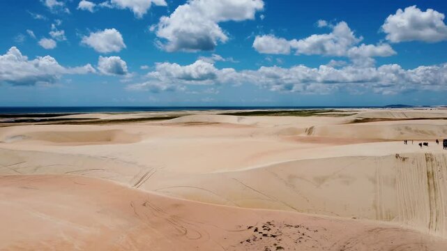 Desert Dunes In Jericoacoara Ceara Brazil. Sand Dunes And Lagoons Forming During The Rainy Season. Coast Clouds Sky Seaside Summertime. Coast Panning Wide. Jericoacoara Ceara.