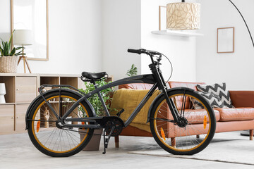 Interior of living room with modern bicycle, sofa and lamp