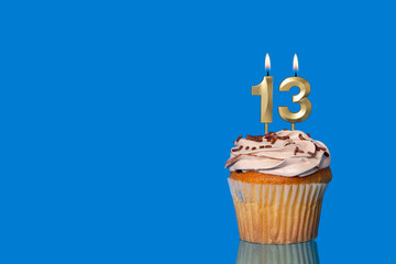 Birthday Or Anniversary Cupcake with Lit Candle; Number 13 Candle.