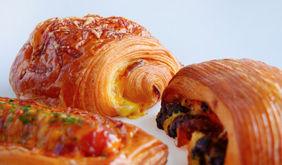 Close up Fresh baked appetizing various kind of croissants, pastry bakery made of croissant dough, Savory Crusty Breads, snack food pain bun