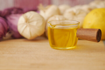 Cooking ingredients including garlic, olive oil, and lemon