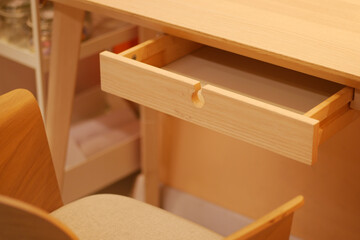 Desk with open drawer in a cozy workspace