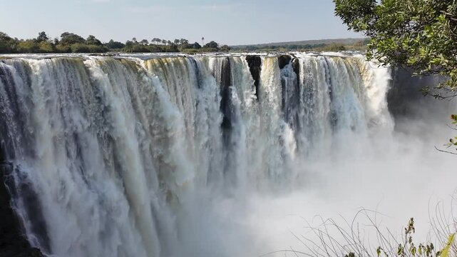 Victoria Falls In Livingstone Northern Rhodesia Zambia. Experience The Majestic Flow Of Waterfalls With Lush Greenery. Idyllic Falls Flowing Water Beautiful Day. Flowing Water.