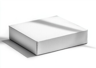 Naklejka premium closed plain white cardboard box casting a shadow on white surface under bright light