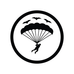 Silhouette of a skydiver with parachute and bats in a circular badge design