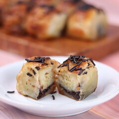 Jakarta's signature baked Bolen cake photographed at various angles of 45 degrees, front view and...
