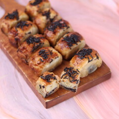 Jakarta's signature baked Bolen cake photographed at various angles of 45 degrees, front view and...