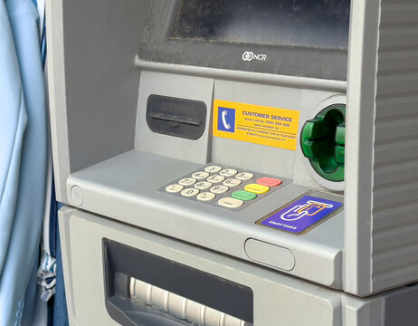 Close-up of automated teller machine keypad and card slot area