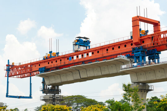 High speed train infrastructure under construction with advanced machinery in clear blue skies