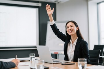 Woman Raising Hand to Speak in a Business Meeting