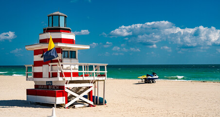 Miami pier. Jetty lifeguard tower on Miami Beach. Scenic view of Miami Beach coastline. Famous...
