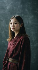 Photo of An Asian Woman With Red Dress Looking At Camera Portrait