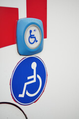 Signs for accessibility near entrance of building