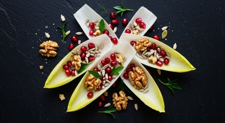Photo of Endive Boats with Pomegranate Seeds and Walnuts on Dark Background