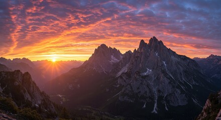 Photo of Dramatic Sunrise over Rugged Mountain Peaks in the Alps