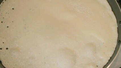 Deliciously Fluffy Pancake Cooking on a Skillet for a Savory Breakfast or Brunch Delight