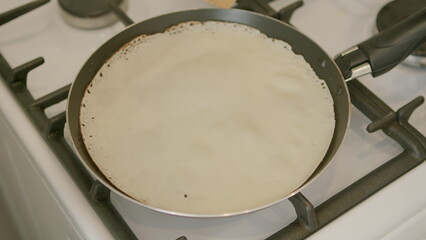 Freshly Cooked Crepe on a Stovetop, a delicious and light dish, perfect for any meal